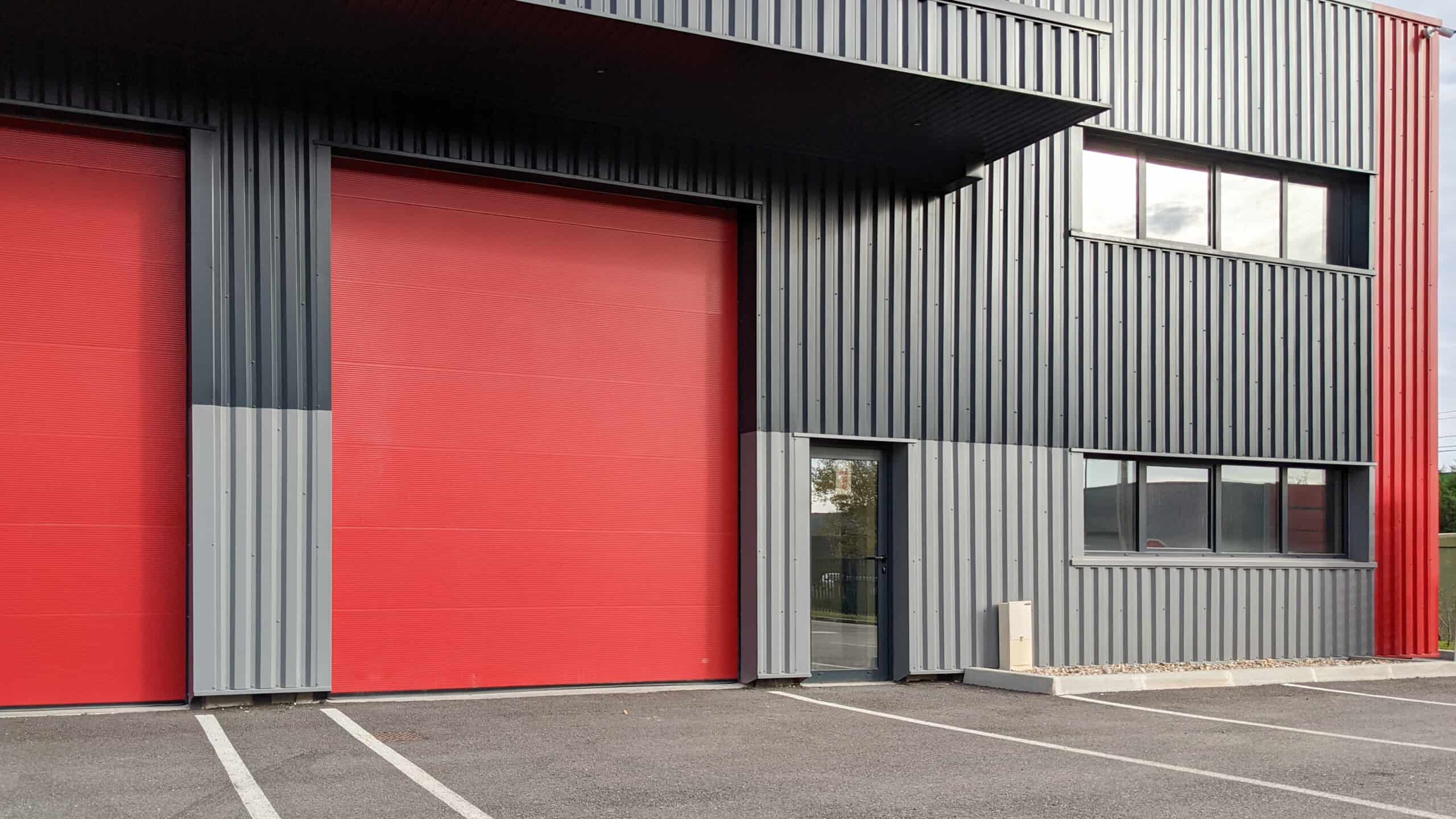 commercial space with two red roller doors